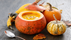 Curried pumpkin soup in a real pumpkin adds flare to an Autumn-themed meal.